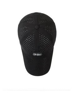 Detailed top view of black breathable mesh baseball cap with diamond laser-cut vents