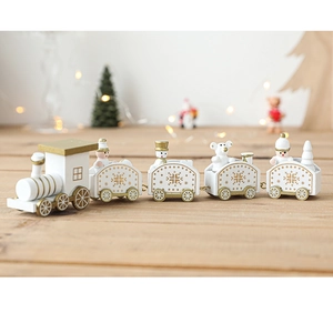 Detailed close-up of white and gold wooden Christmas train with snowman and bear figures
