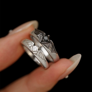 Adjustable silver angel and black demon wings couple rings with central gemstones