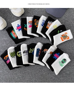 Close-up of sporty crew socks featuring street-style graffiti lettering on cotton fabric