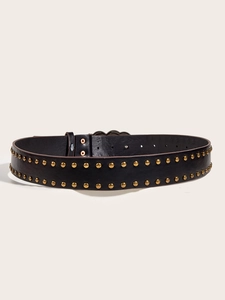 Close-up of black leather belt with double rows of gold studs and metal buckle details