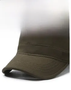 Detail of dark brown military flat top hat featuring metallic sports style emblem and stitching
