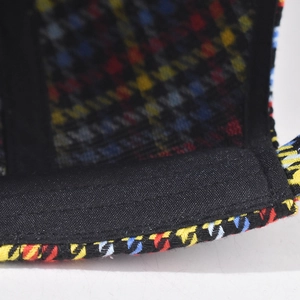 Detailed close-up showing the high-quality stitching and sweatband inside the plaid cap