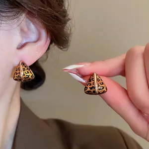 Gold plated geometric triangle leopard print earrings with vintage aesthetic