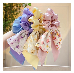 Three-piece floral silk scarf scrunchie set in purple, yellow and pink floral patterns
