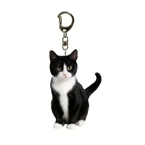 Double-sided acrylic tuxedo cat keychain with a silver swivel clasp for backpacks