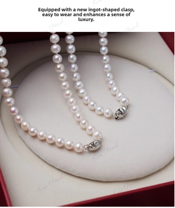 Detailed macro view of white freshwater pearl necklace with silver toggle clasp in jewelry box