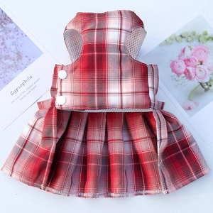 Detail of red and white plaid pet dress with white buttons and breathable mesh lining