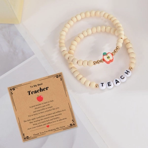 Natural wood bead bracelet with red apple charm and TEACHER letter beads on a gift card