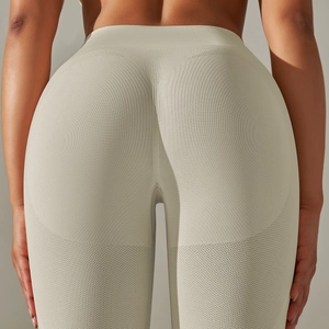 Detail of seamless high-waisted yoga leggings showing bum lifting texture and ribbing