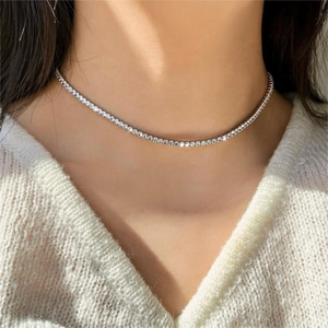 Elegant silver tennis necklace with sparkling cubic zirconia on a model neck