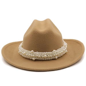 Detail of elegant camel wool fedora hat featuring a premium multi-layer white pearl band