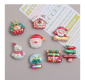 Set of 8 iridescent Christmas resin charms including Santa, snowman and tree for DIY crafts
