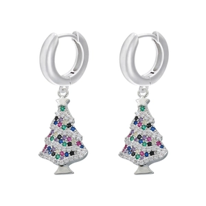 Detailed macro view of silver Christmas tree earrings with colorful zircon stones