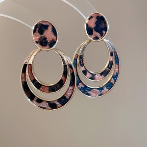 Elegant gold double hoop earrings with a stylish leopard print pattern for women