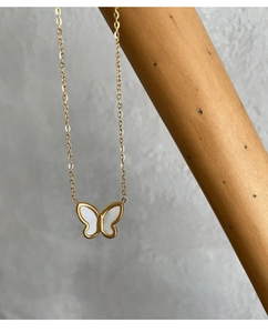 Detail of butterfly necklace with white mother of pearl inlay and polished metal chain
