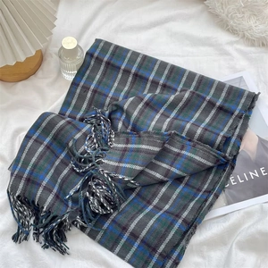 Winter warm gray and blue plaid scarf with long tassels in soft cashmere texture
