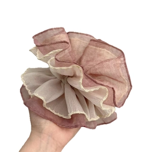 Large pink and white layered chiffon scrunchie shown in hand for fluffy size