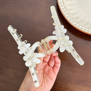 Sweet floral candy-colored hair claw clip made of clear acrylic with white flower accents