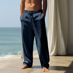 Detail of navy blue linen trousers with elastic drawstring waist and breathable fabric texture