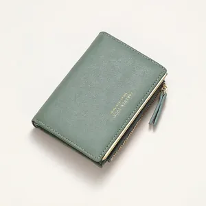 Short dark green bifold leather wallet for women with golden zipper and lychee texture