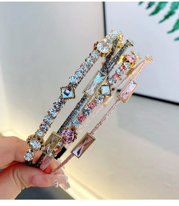 Detailed view of layered metallic headbands featuring multi-color sparkling crystals