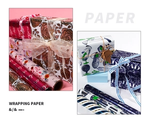 Close-up view of elegant floral and golf themed decorative gift wrapping paper rolls