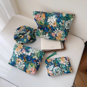 Floral quilted cotton storage bag set with three zipper pouches and matching scrunchie