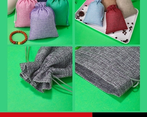 Close-up of multicolored linen drawstring pouches showing woven texture and cord closure