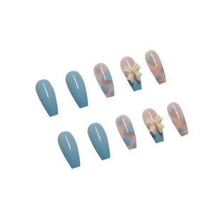Blue and nude press-on nails with white 3D bows and heart patterns in coffin shape