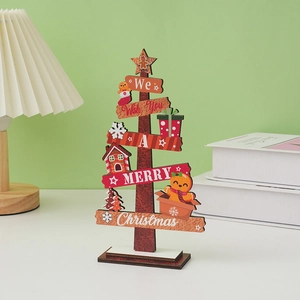 Detail of wooden Christmas tree desktop decor with Merry Christmas text and gingerbread man
