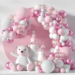 Pink and white balloon arch kit with metallic balloons and a white teddy bear statue