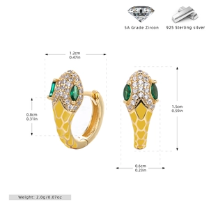 Macro detail of gold snake earrings with yellow enamel, zircon eyes and 925 silver markers