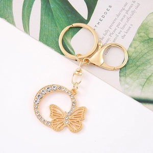 Close-up of gold butterfly keychain with crystal rhinestones and lobster clasp