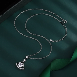 Macro detail of 925 sterling silver stamp and spring clasp on silver chain necklace