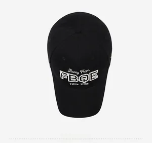 Top view of a black baseball cap featuring detailed white 3D embroidery and twill fabric