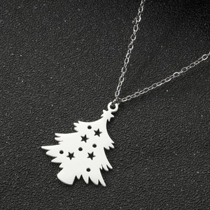 Macro view of silver Christmas tree pendant with hollow star and geometric details