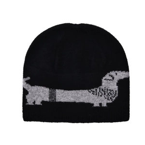 Detail of dachshund jacquard pattern on a black ribbed knit beanie for winter
