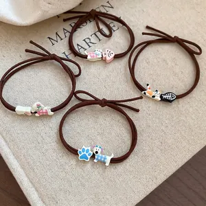 Set of four cute cartoon hair ties with cat and dog resin pendants on dark brown ropes