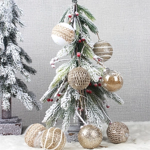 Set of 8cm rustic Christmas ornaments with twine and glitter on snow-covered pine tree