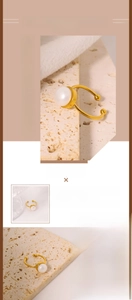 Detailed view of natural freshwater pearl on an adjustable golden titanium steel ring