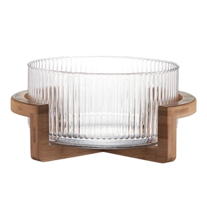 Soda-lime glass fruit bowl with vertical stripes and minimalist wooden stand base