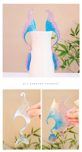 Detail of DIY fairy wing earrings made from resin molds with glitter and gradients