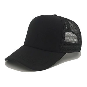 Detail of breathable mesh panel and sturdy stitching on a black trucker baseball cap