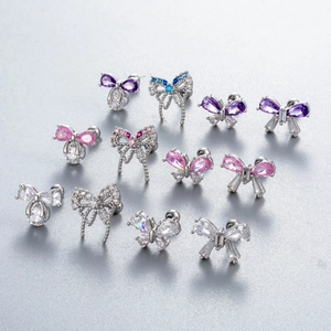 Bow and butterfly cartilage studs with cubic zirconia in assorted colors and silver finish