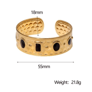 Detail view of 18K gold plated bangle with dimensions 18mm width and 55mm inner diameter