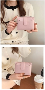 Close-up of pink textured canvas wallet with snap closure and zipper compartment