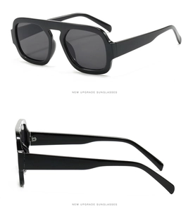 Detail view of black square frame sunglasses with dark grey lenses and a sleek mirror finish
