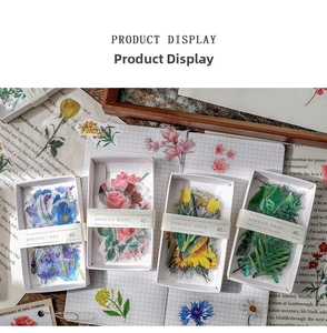 Close-up of four floral sticker boxes with 40 dried flower decals for vintage journaling