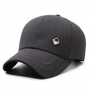 Dark grey herringbone baseball cap with metal fashion tag and embossed sport peak